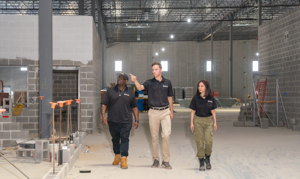 A fire extinguisher and fire alarm symbol, representing the importance of fire watch in ensuring safety and preventing fires.