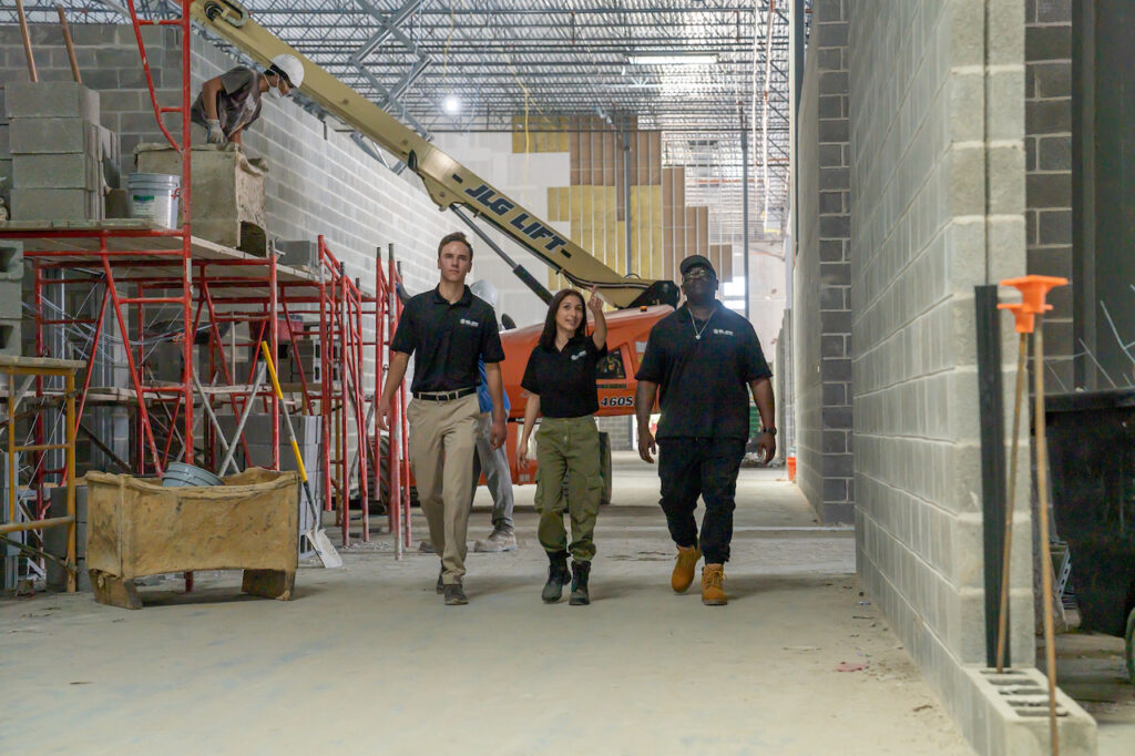 Manufacturing plant with workers operating machinery on the production line